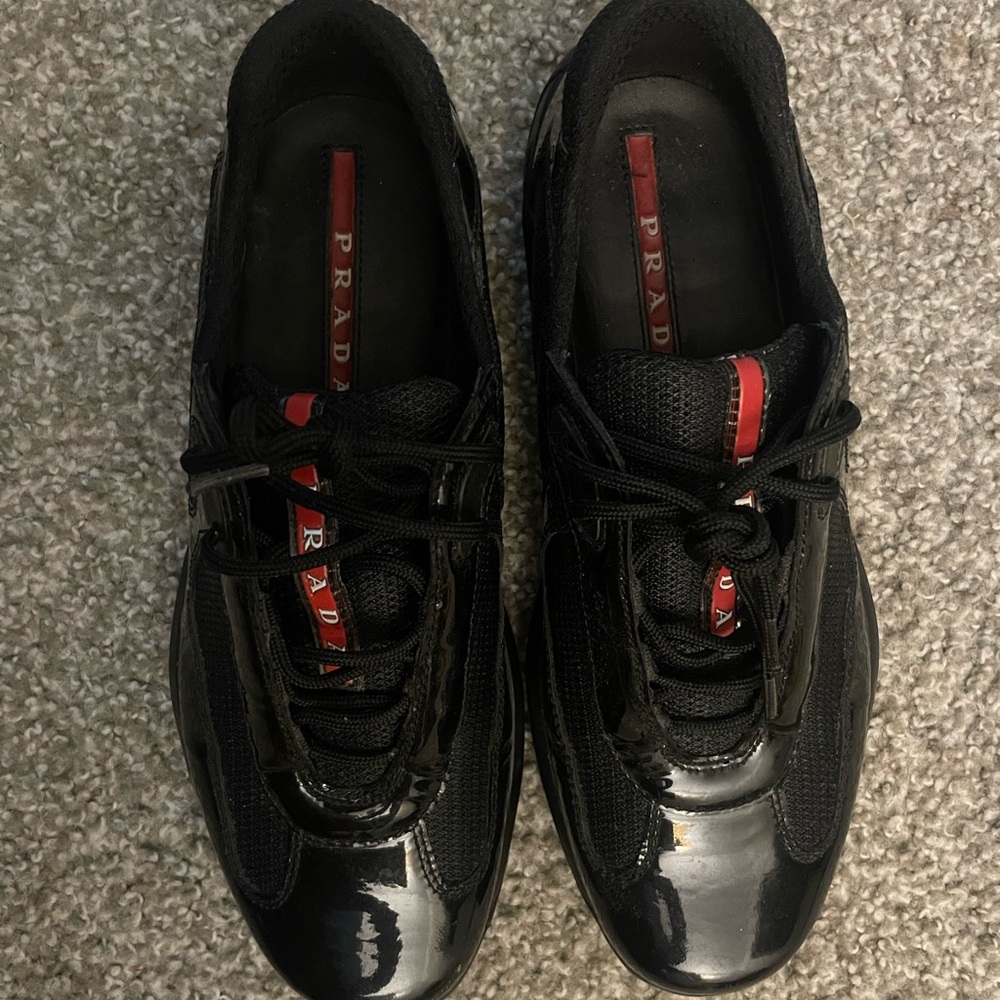 Prada Glossy Black Sneakers with Red Accents